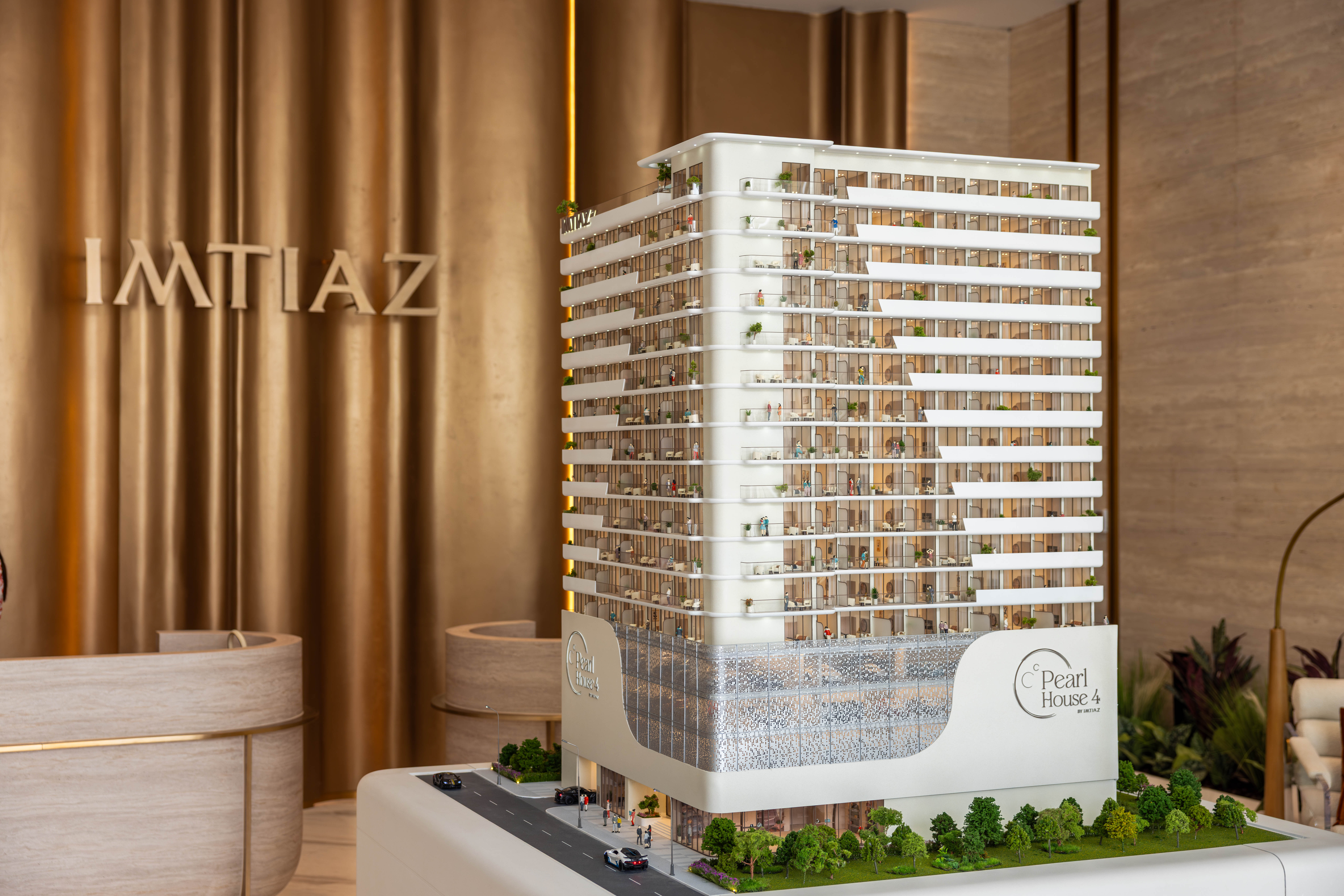 Events?Page=2 A detailed scale model of a modern building named Pearl House 4, displayed in a stylish setting.