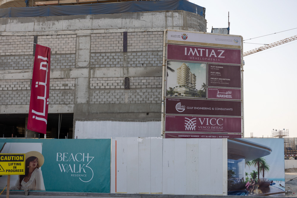 Beach Walk Iii By Imtiaz Construction site featuring a large billboard for Imtiaz Developments and a "Beach Walk" residence advertisement.