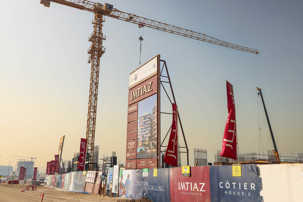 Cotier House 2 By Imtiaz Construction site featuring a large sign for Imtiaz developments, a crane, and construction barriers.