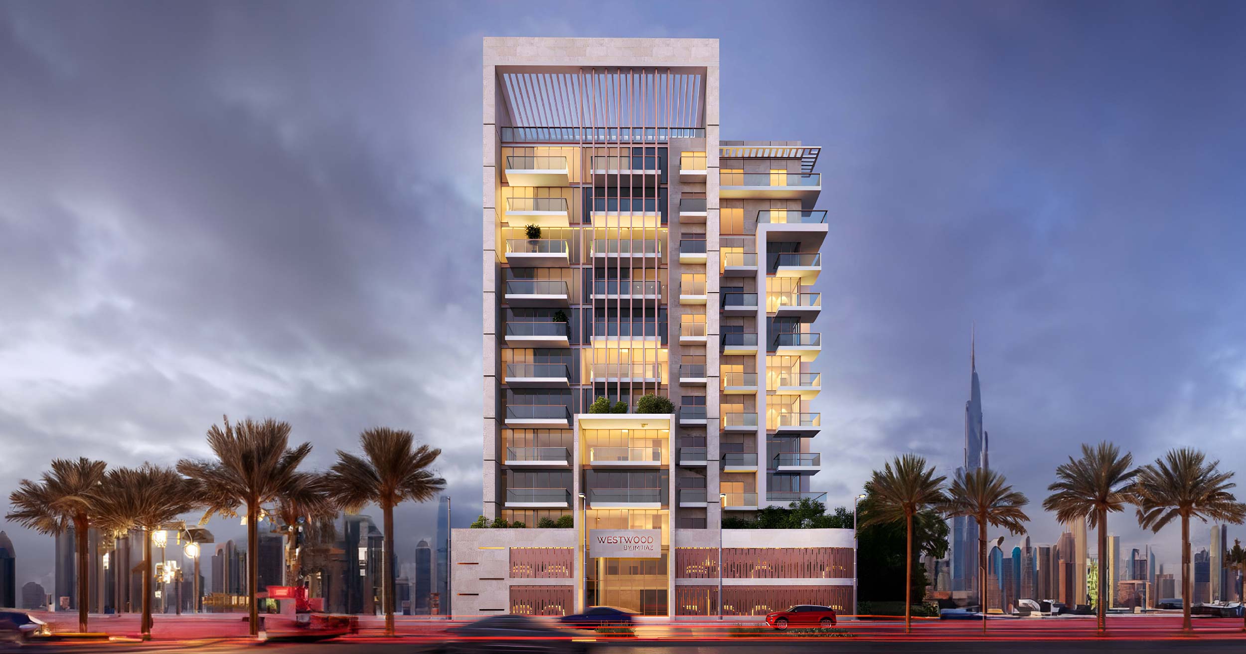 Westwood By Imtiaz Modern high-rise building with balconies, lit windows, palm trees, and a city skyline in the background under cloudy skies.