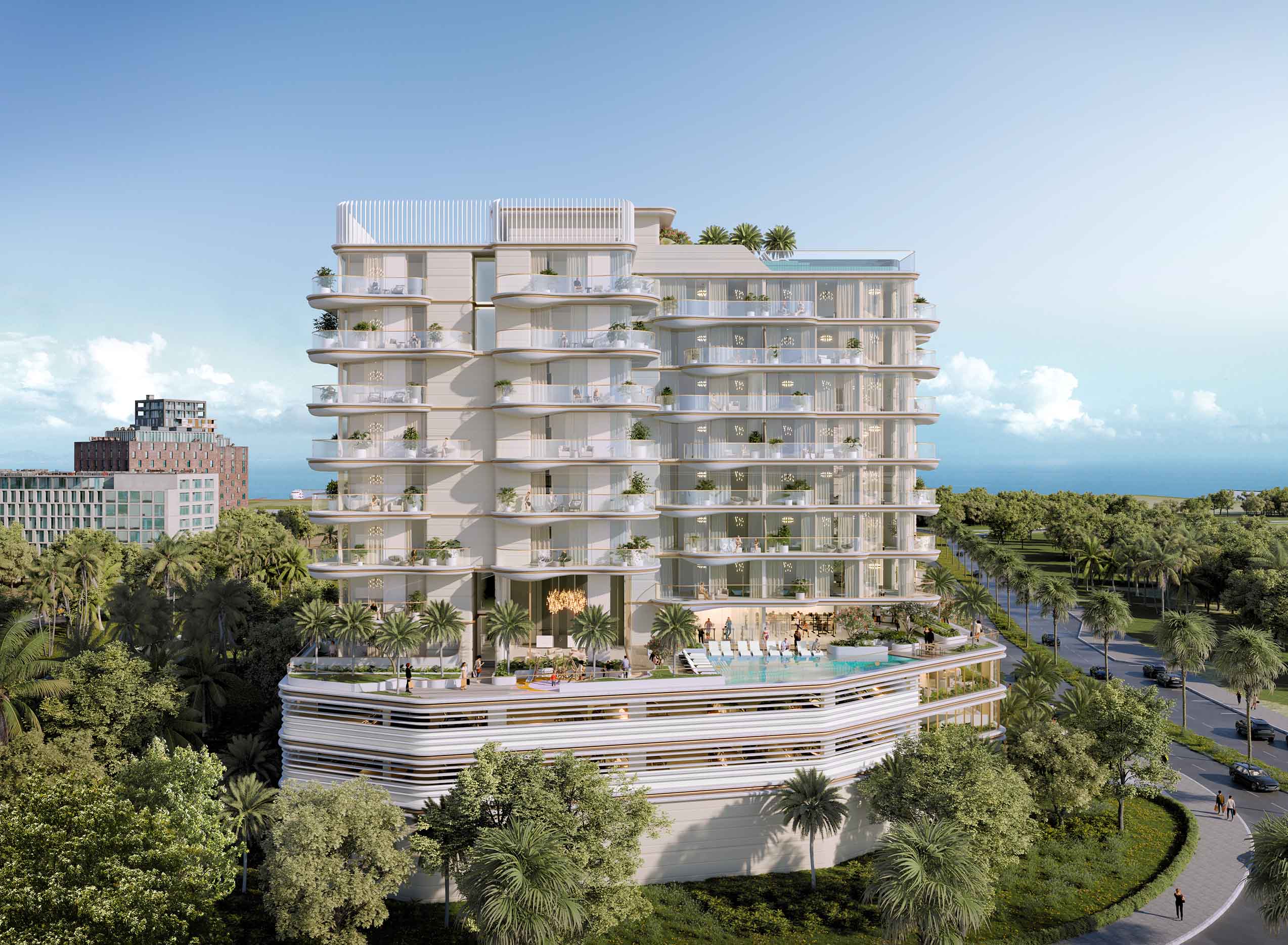 Beach Walk 4 By Imtiaz A modern multi-story building with balconies, surrounded by palm trees and a pool area, against a clear sky.