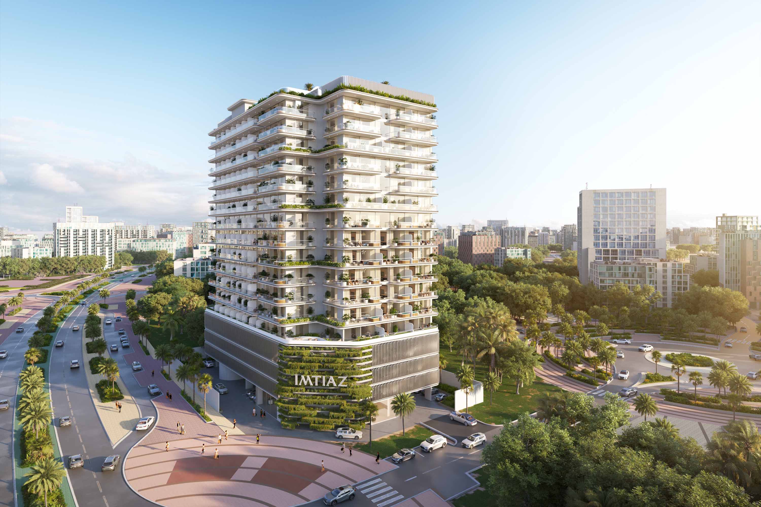 Cove Edition Iii By Imtiaz A modern residential building surrounded by greenery, streets, and vehicles, showcasing contemporary architecture.