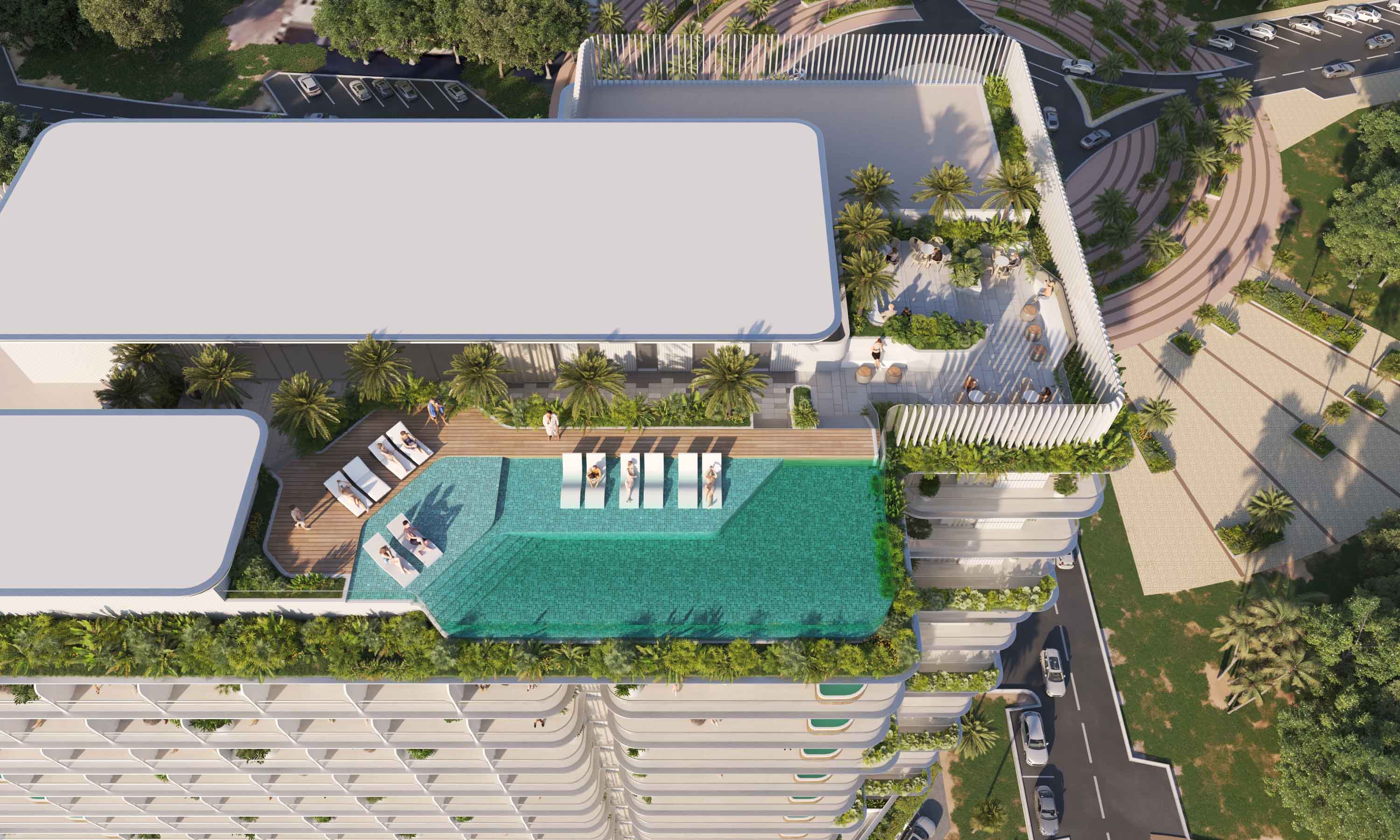 Cove Edition Iii By Imtiaz Aerial view of a modern building with a rooftop pool, lounge chairs, and greenery surrounding the area.