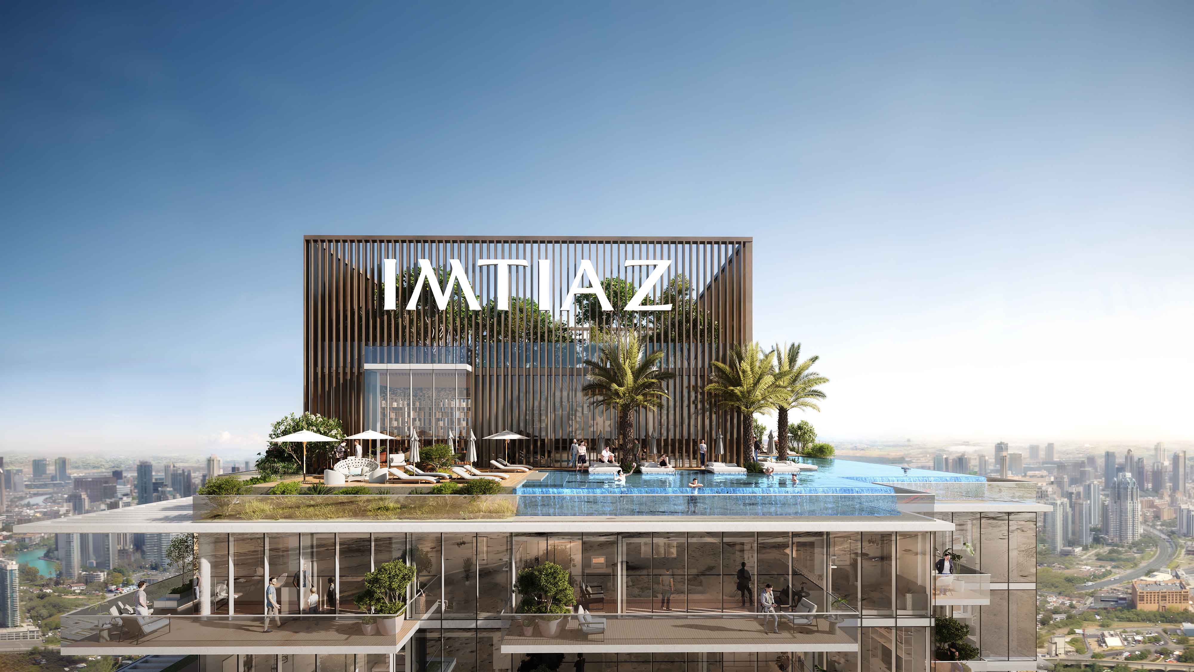 Cove Boulevard By Imtiaz Modern building with a rooftop pool, palm trees, and the name 'IMTIAZ' prominently displayed against a clear sky.
