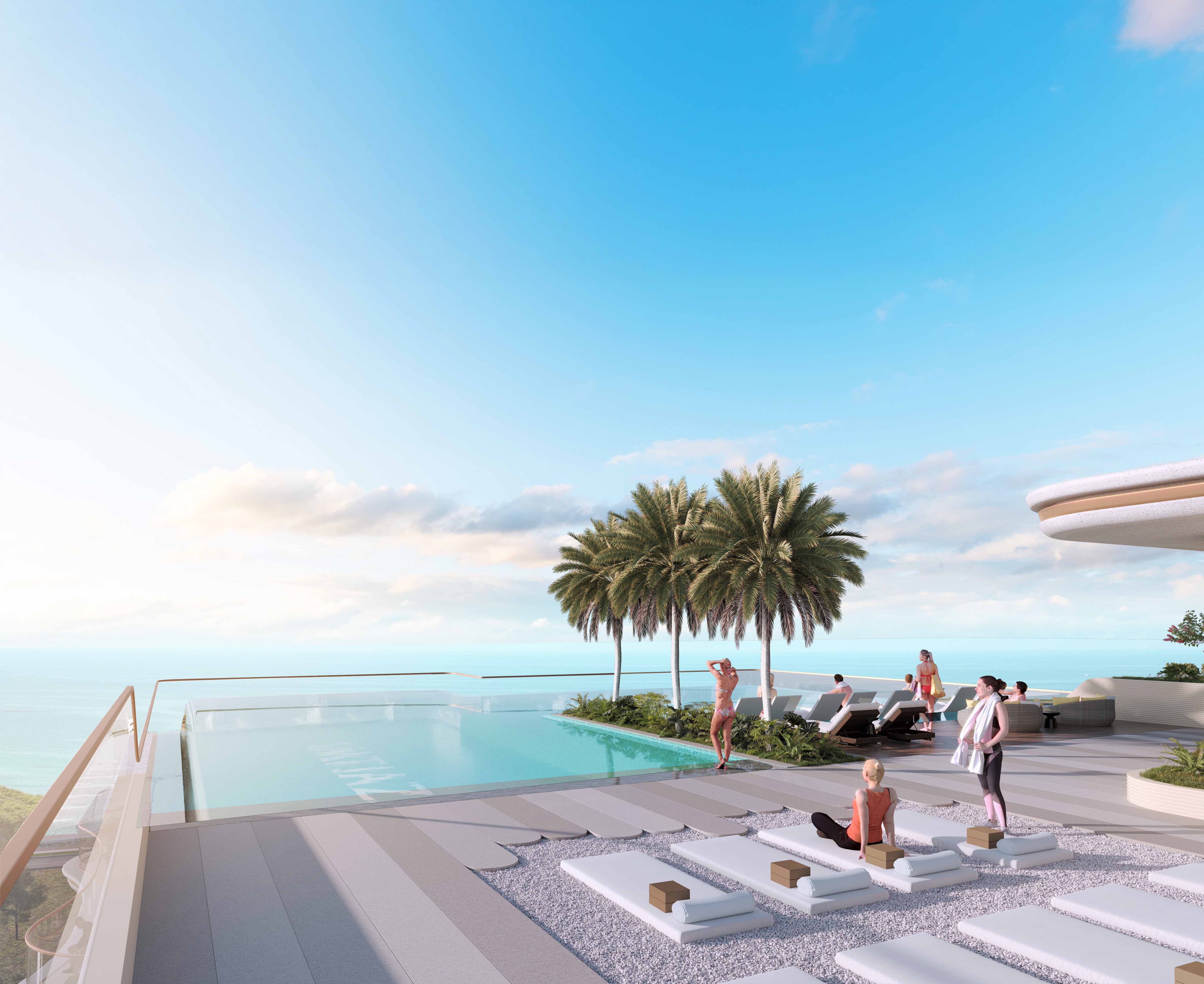 Beach Walk 4 By Imtiaz A stylish outdoor pool area featuring lounge chairs, palm trees, and people enjoying the sunny coastal view.