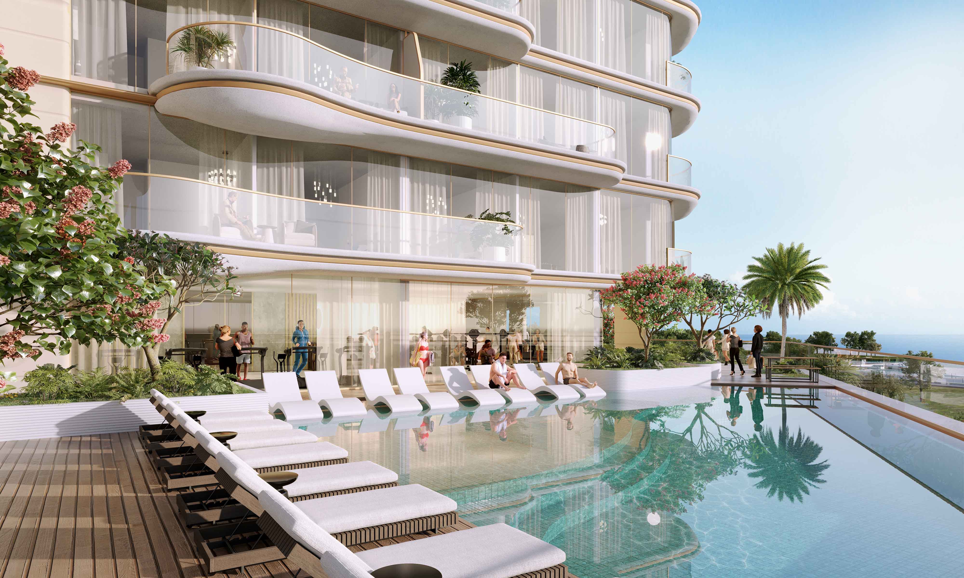 Beach Walk 4 By Imtiaz A modern luxury building with a pool, lounge chairs, and people socializing in a sunny outdoor setting.