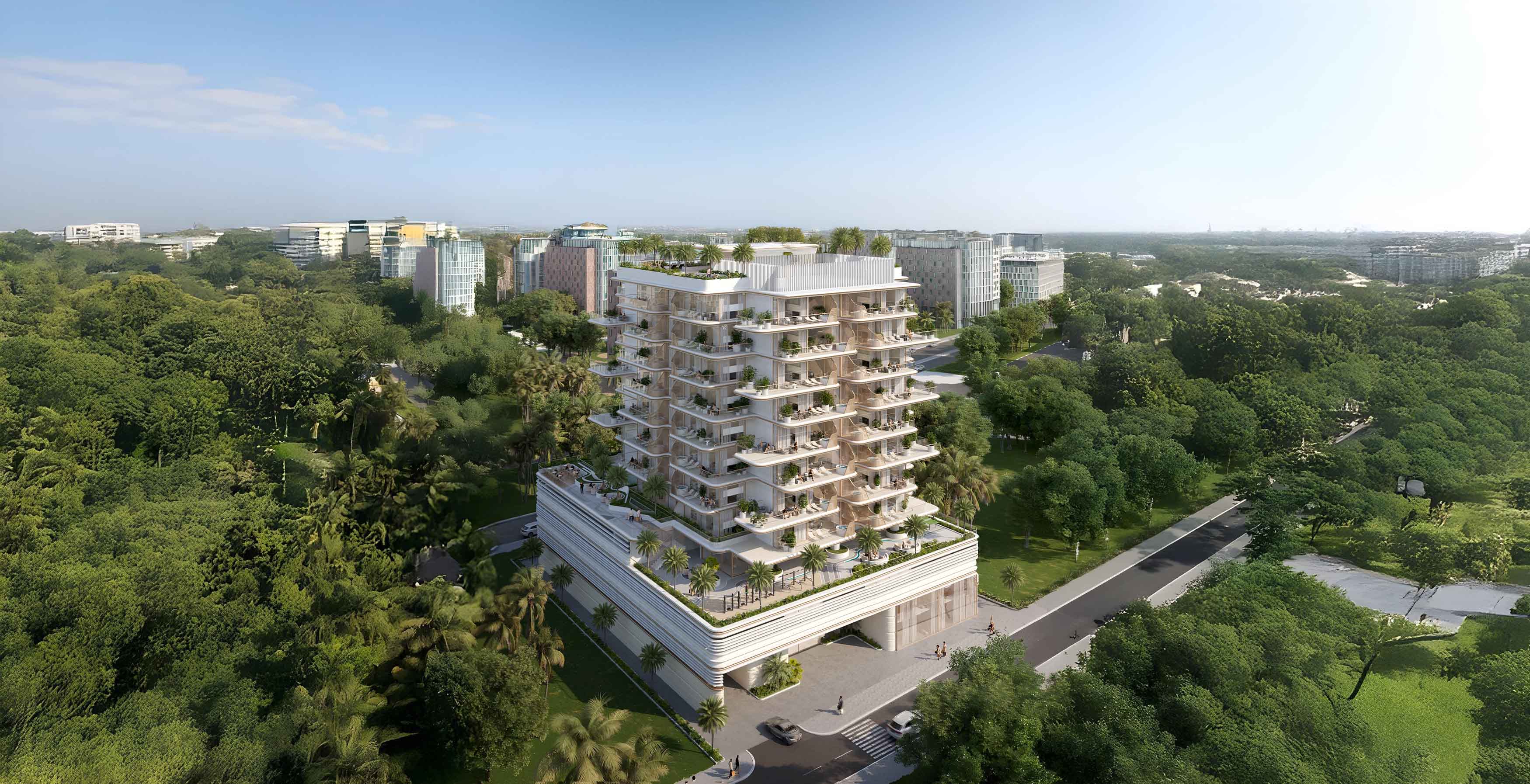 Sunset Bay 4 By Imtiaz A modern multi-story building surrounded by lush greenery and urban structures under a clear blue sky.