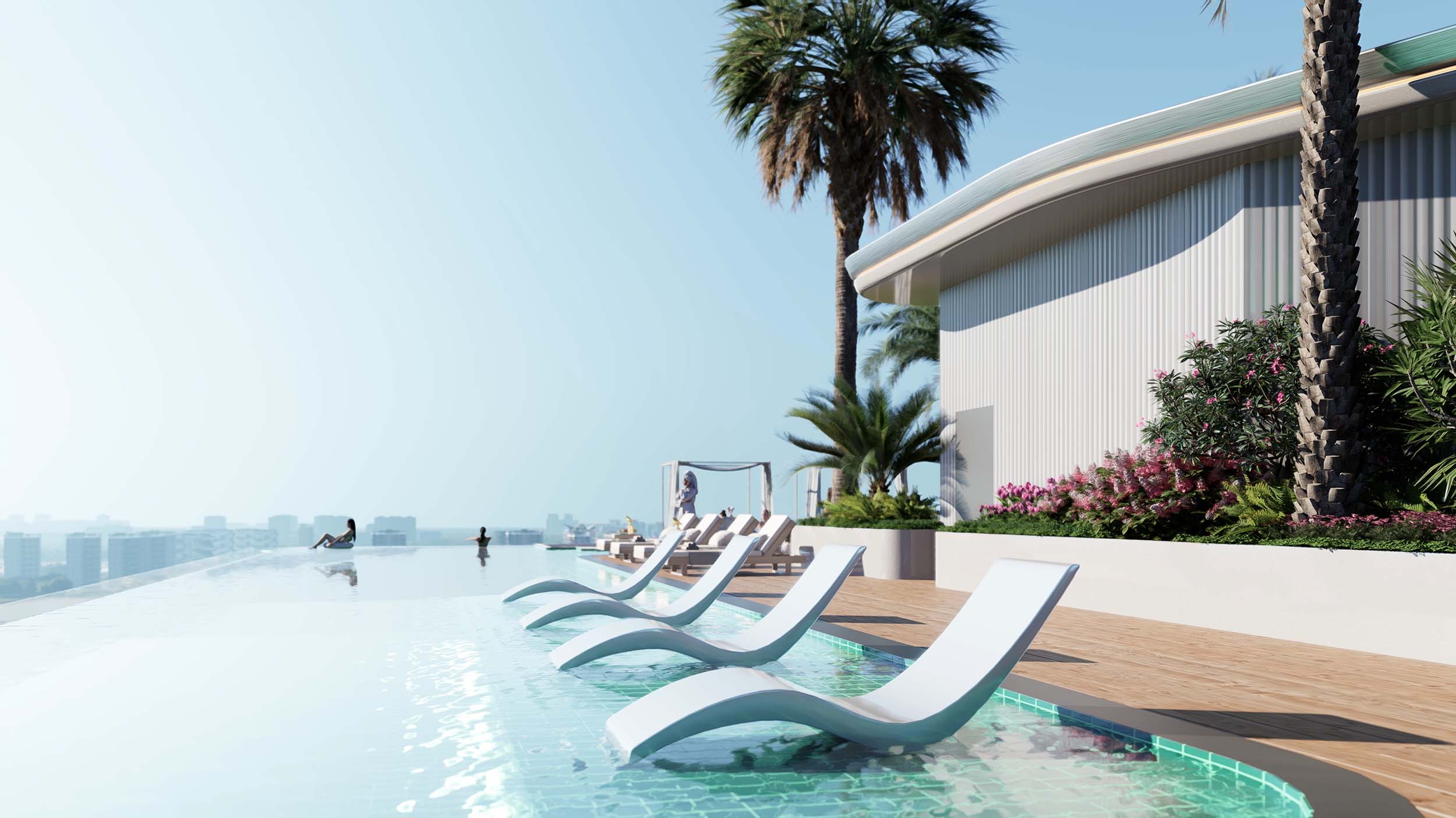 Cove Grand By Imtiaz A luxurious infinity pool with lounge chairs, palm trees, and modern architecture under a clear blue sky.