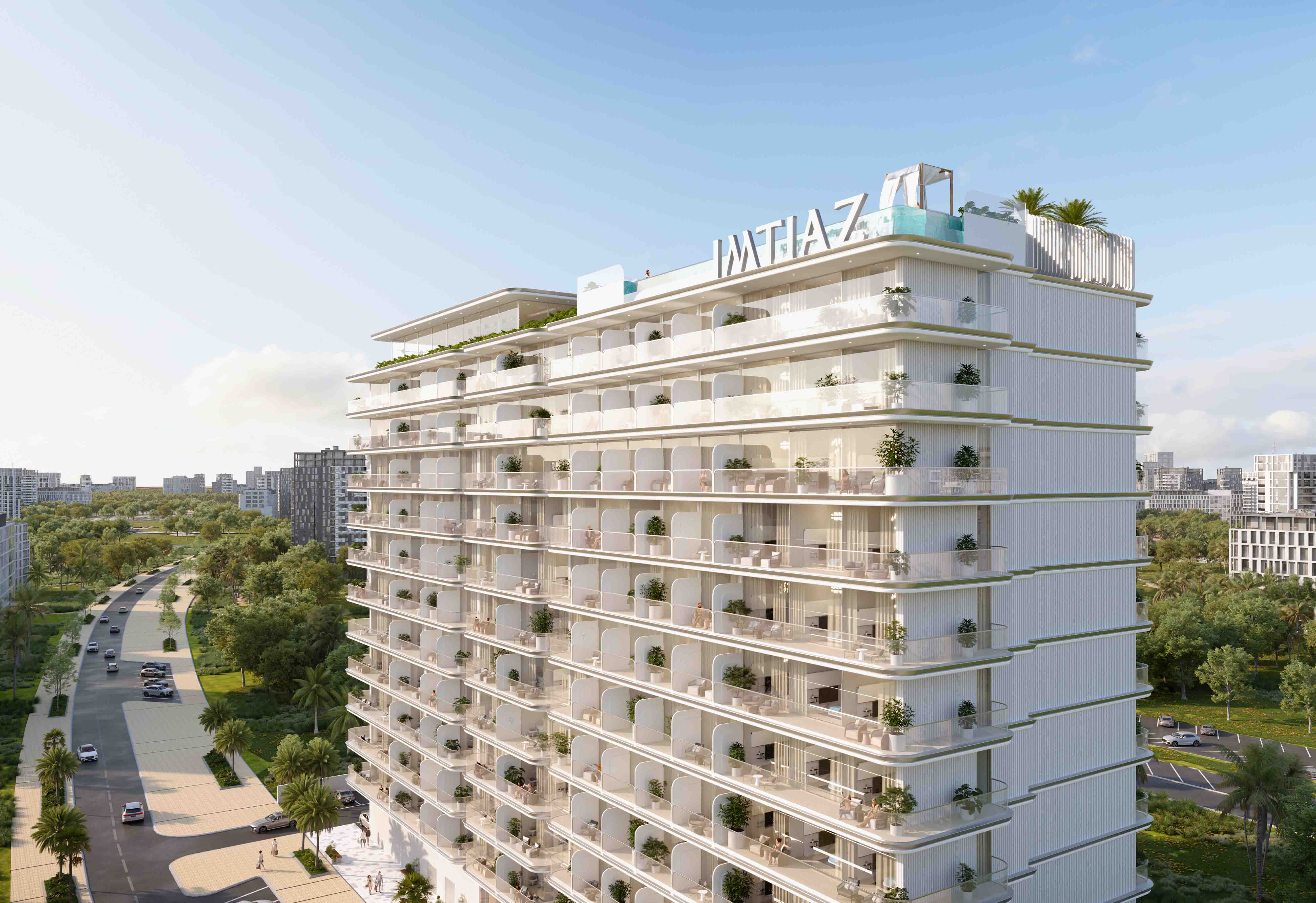 Cove Edition 6 By Imtiaz 1 A modern residential building with balconies, greenery, and a view of nearby roads and trees under a blue sky.