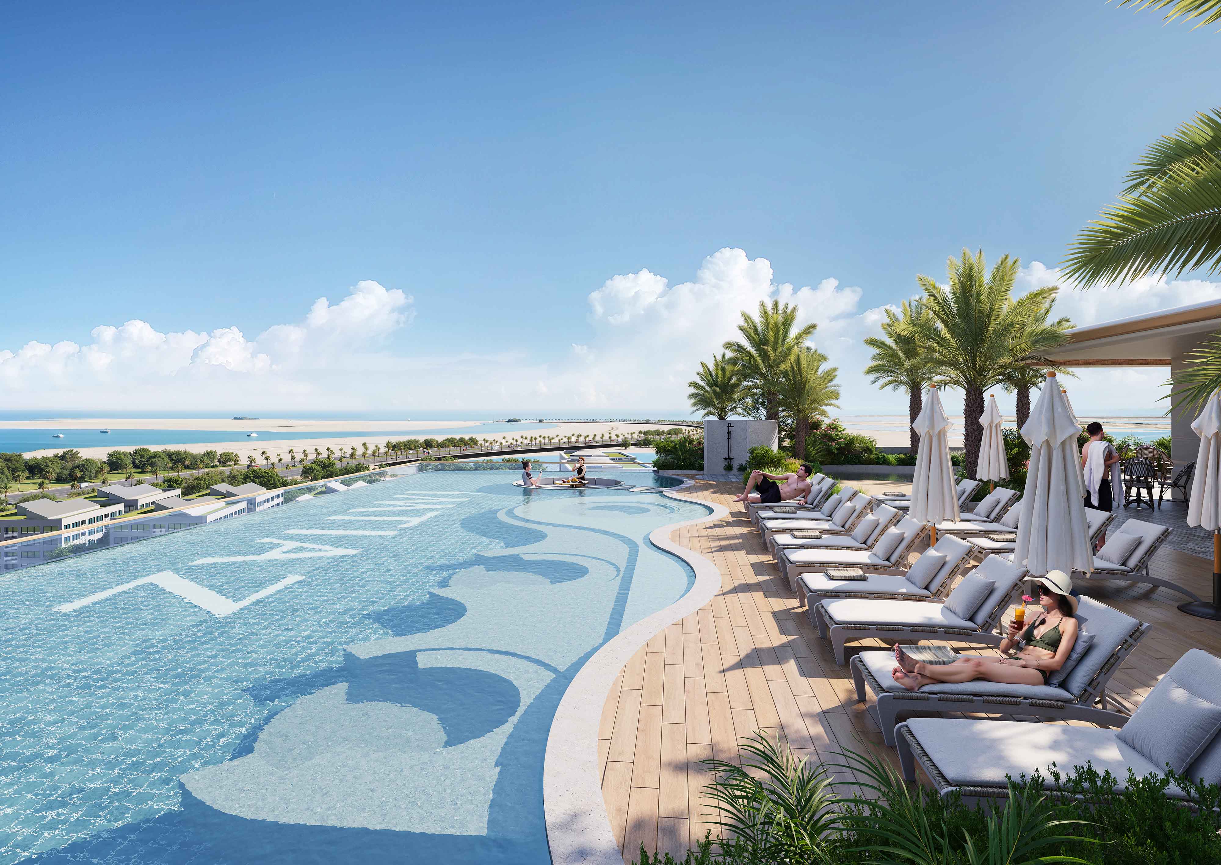 Sunset Bay 5 By Imtiaz A luxurious pool area with lounge chairs, palm trees, and a view of the beach and ocean under a clear blue sky.