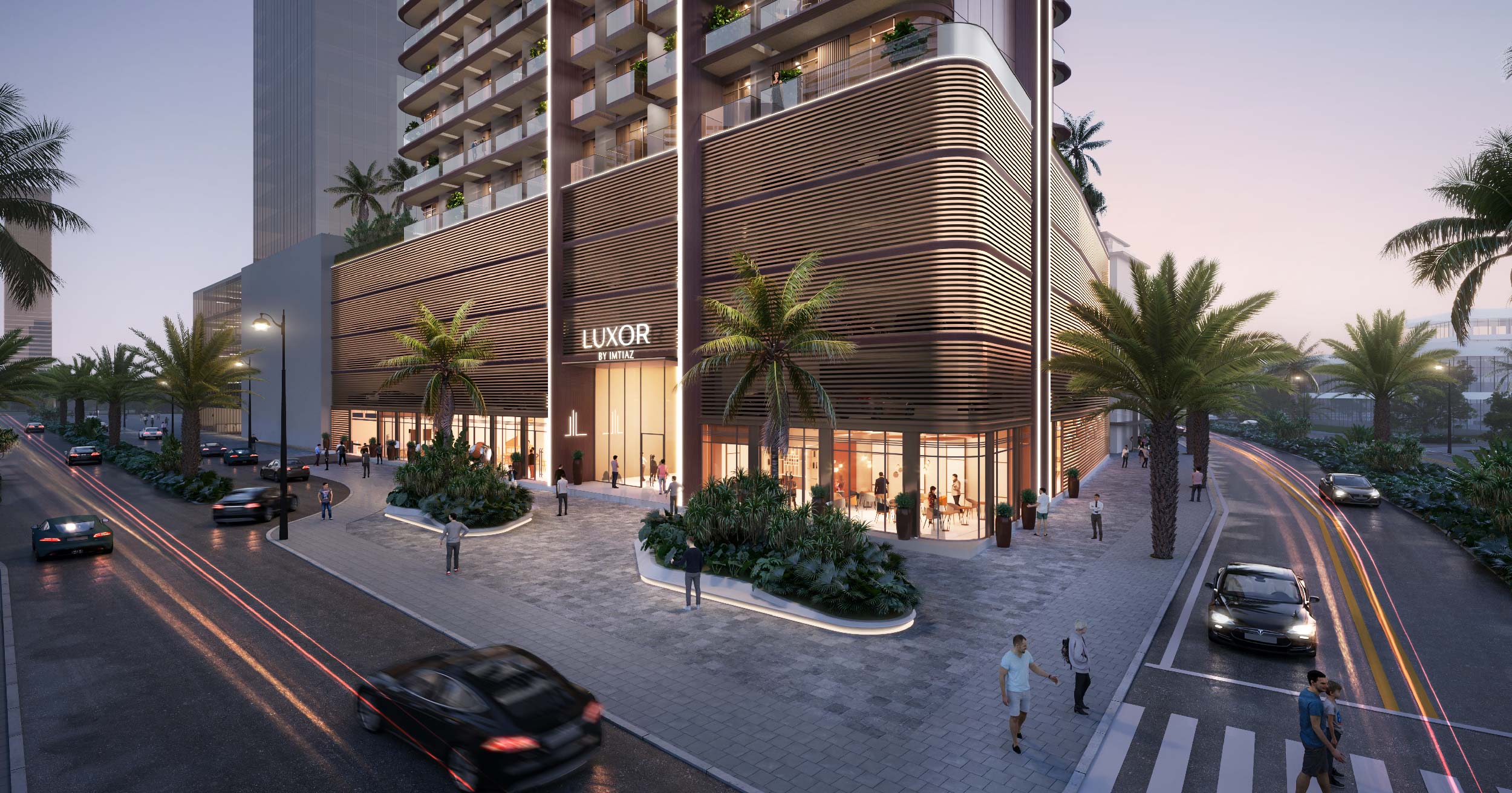 Luxor By Imtiaz A modern building with palm trees, people, and cars, showcasing the entrance to Luxor by Imtiaz at dusk.