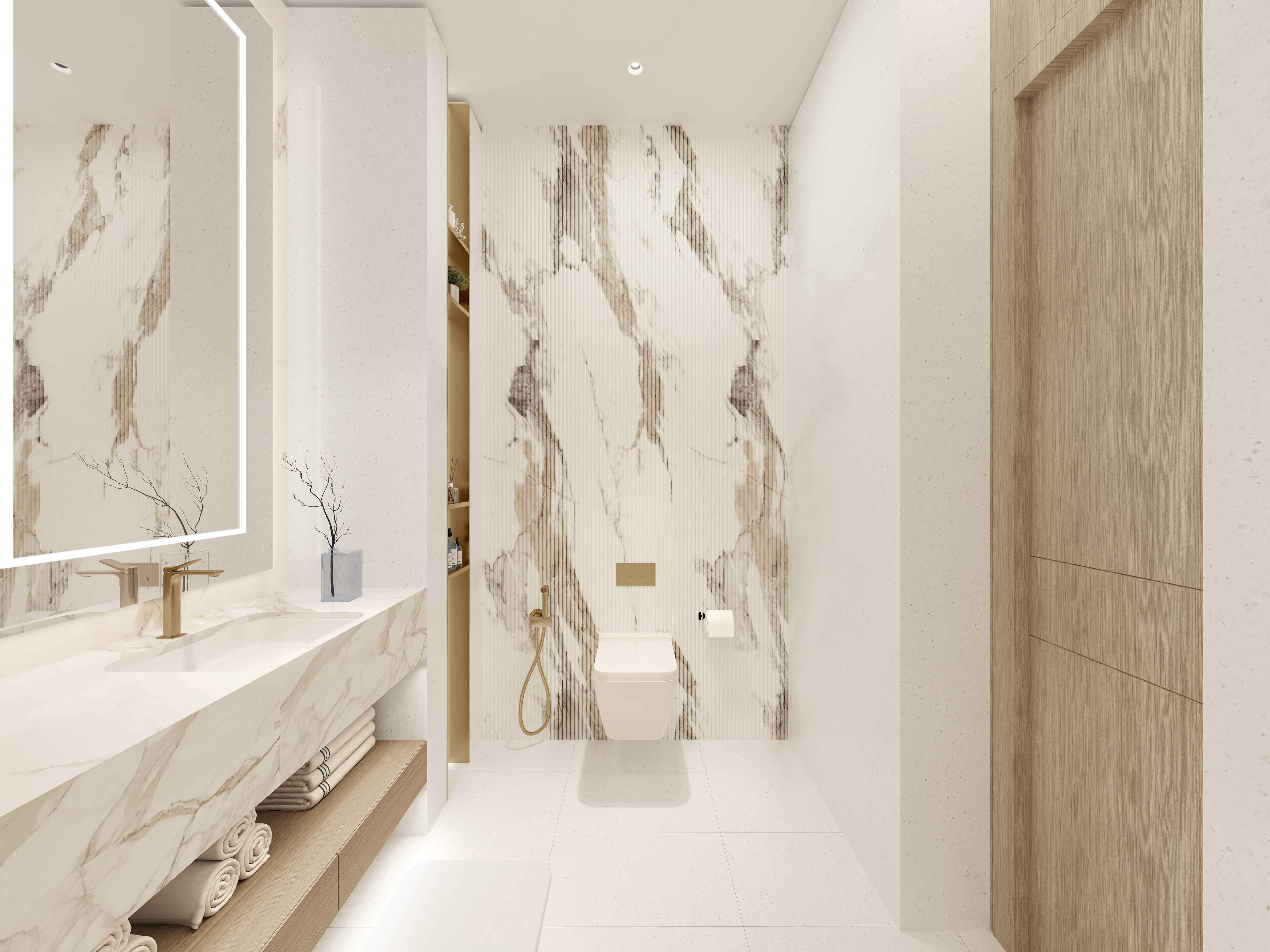 Beach Walk Grand 2 By Imtiaz Modern bathroom featuring marble walls, a sleek countertop, towels, and minimalistic design elements.