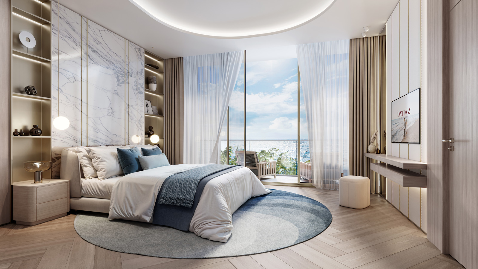 Sunset Bay Grand By Imtiaz A modern bedroom with a large window, ocean view, elegant furnishings, and a circular rug.