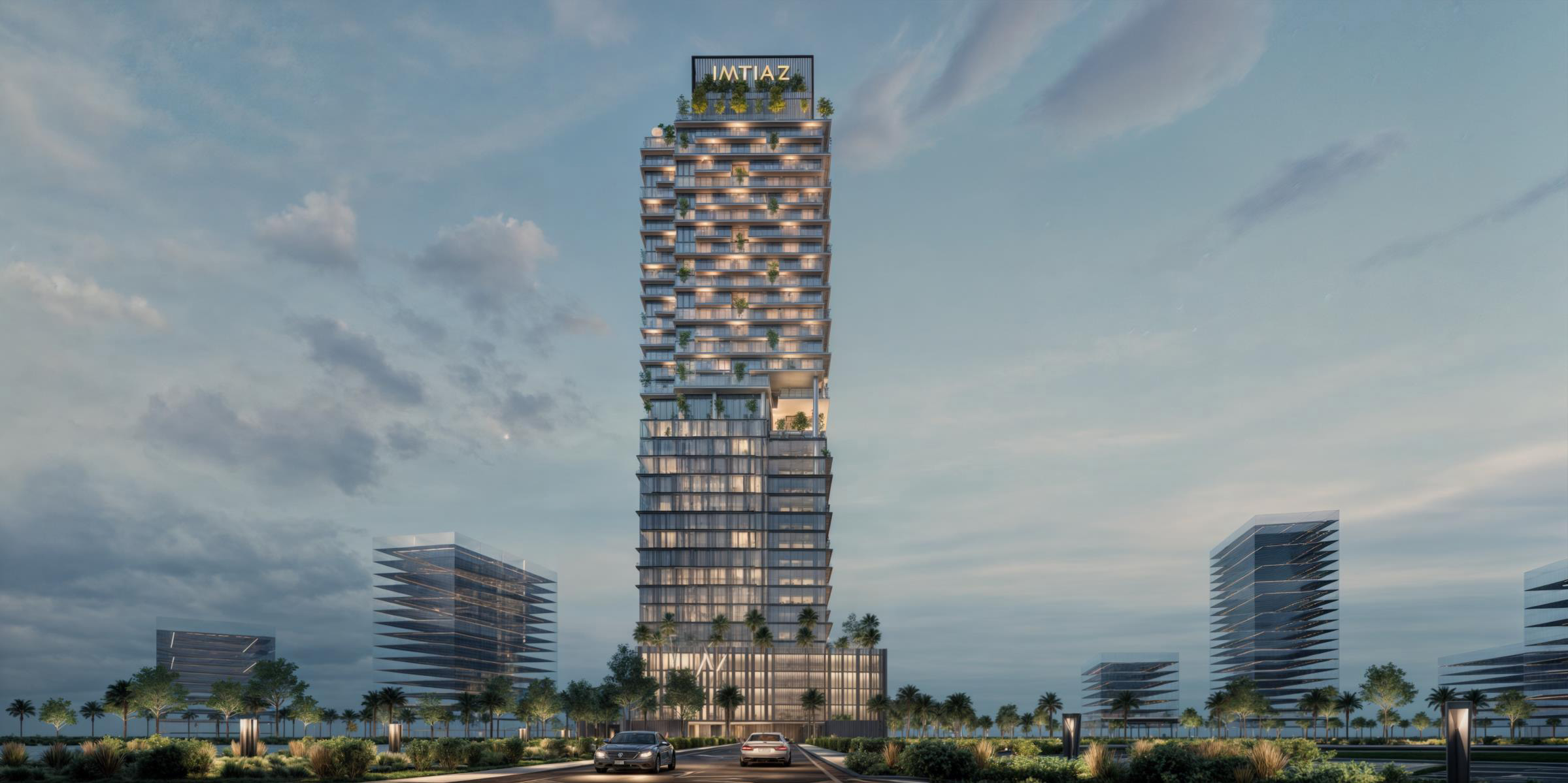 Properties A modern tall building with greenery, featuring large windows and a rooftop sign, surrounded by smaller structures.