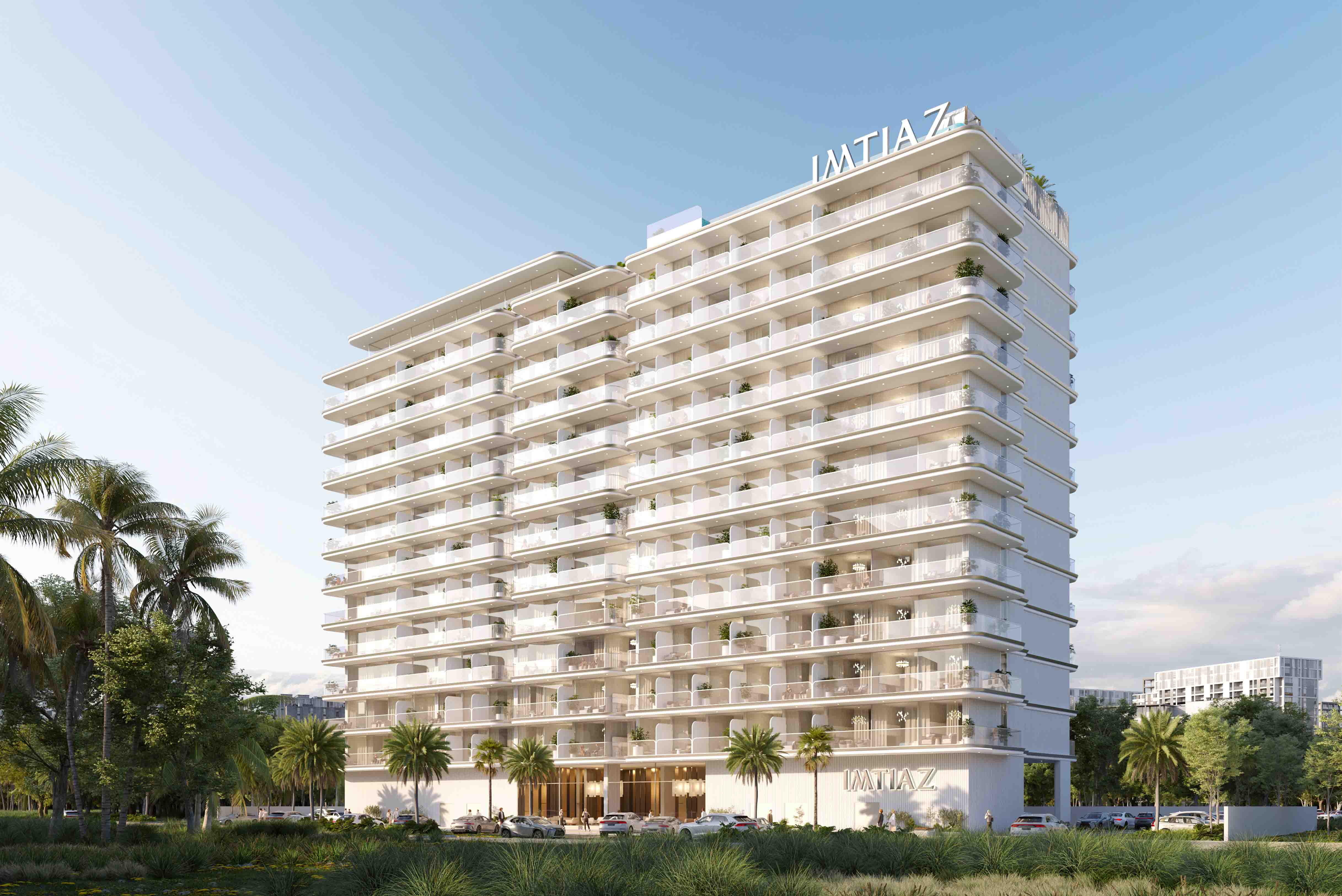 Properties A modern white building with multiple balconies, surrounded by palm trees and a clear blue sky, features the name "IMTIAZ."